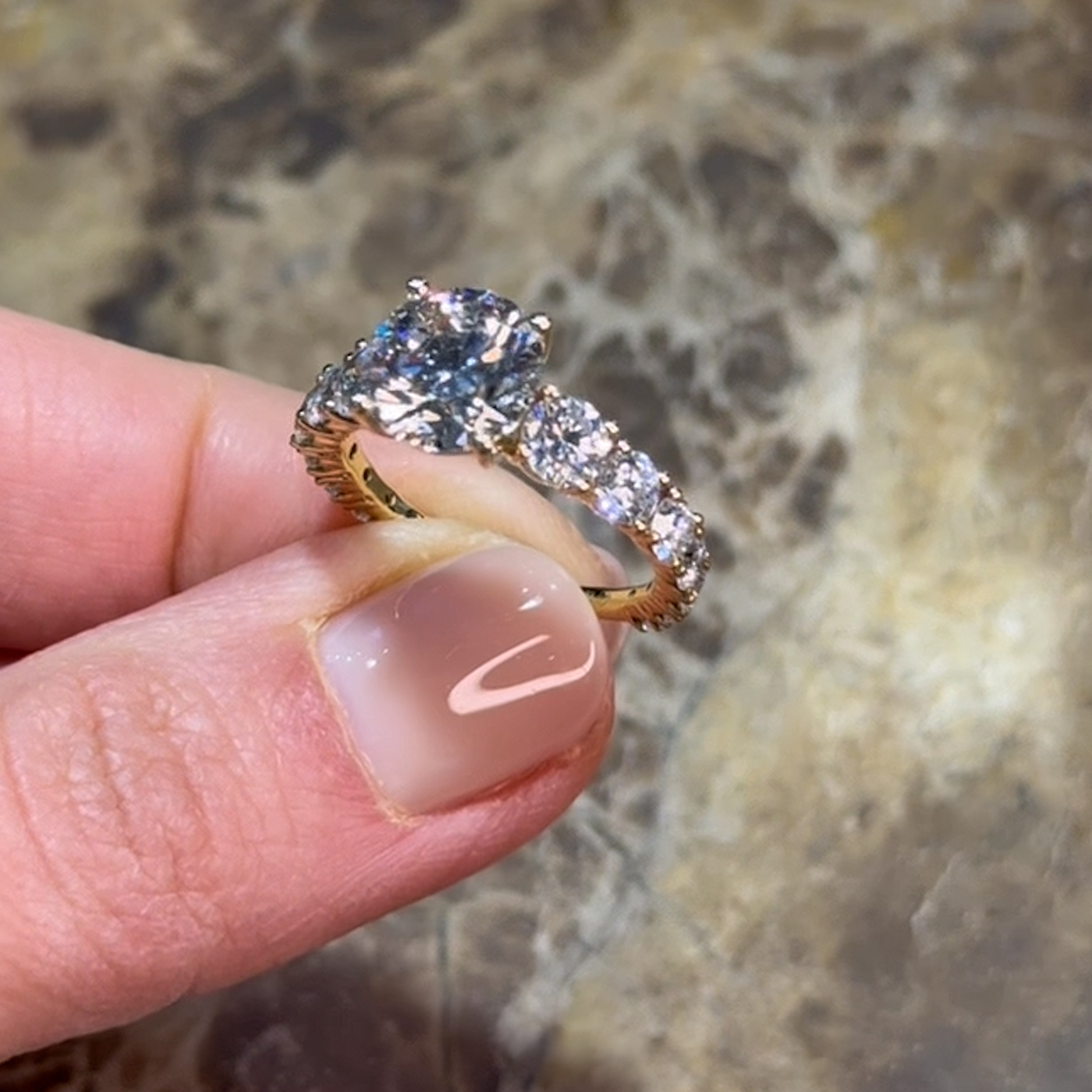 18k yellow gold round lab-grown diamond engagement ring with ¾ set graduating round diamonds