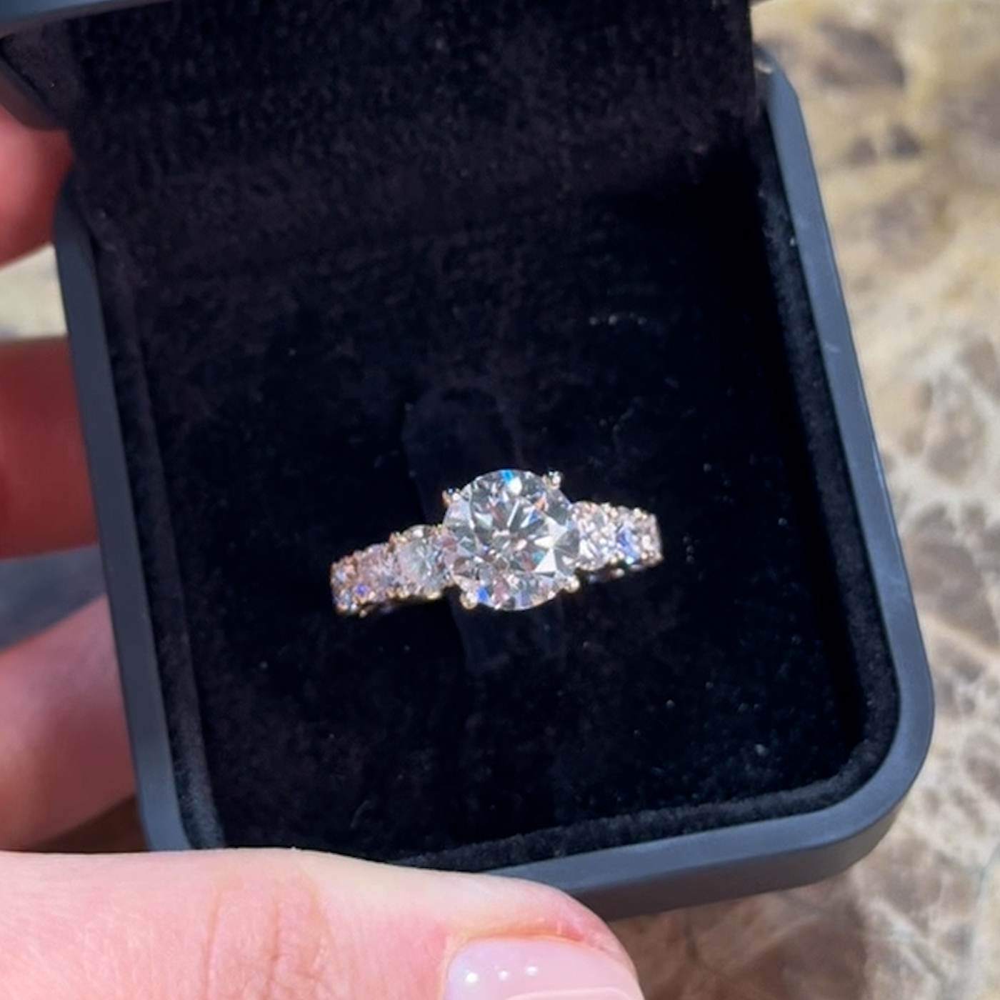 18k yellow gold round lab-grown diamond engagement ring with ¾ set graduating round diamonds