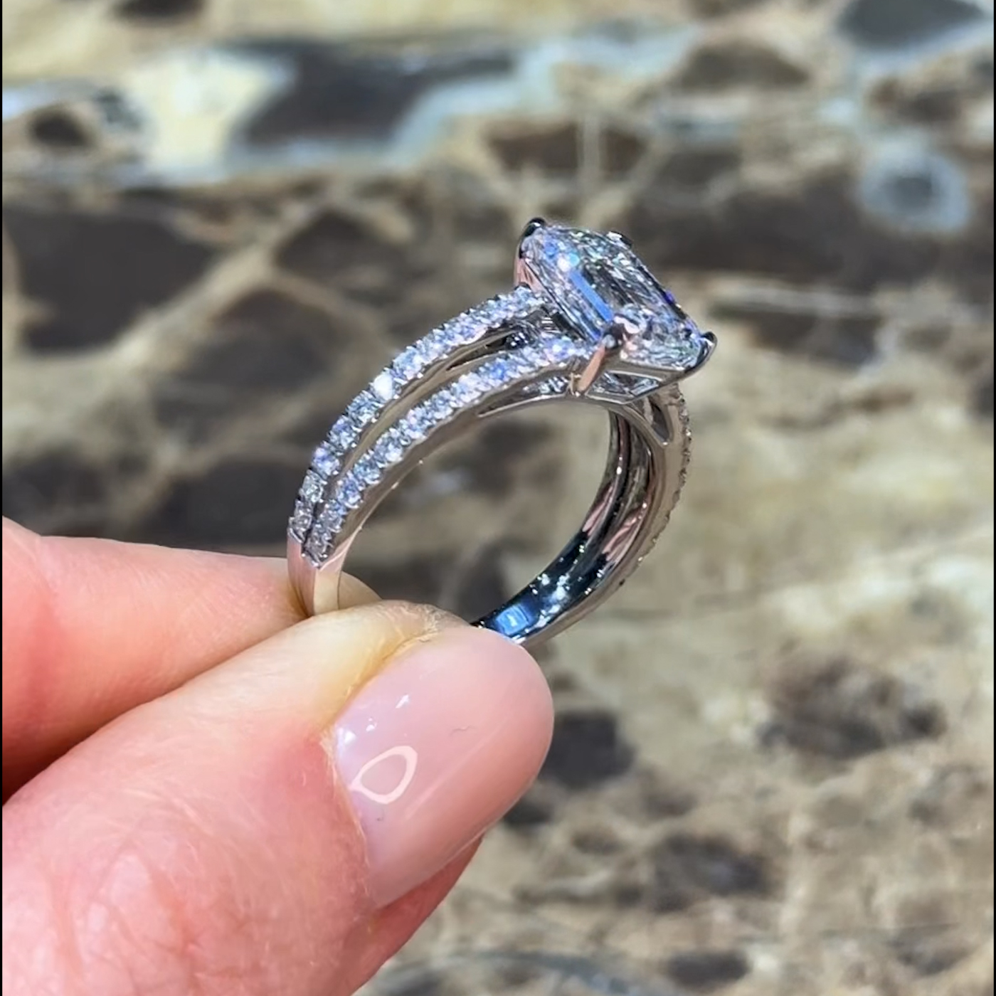 18k white gold emerald cut lab-grown diamond engagement ring with split pavé band