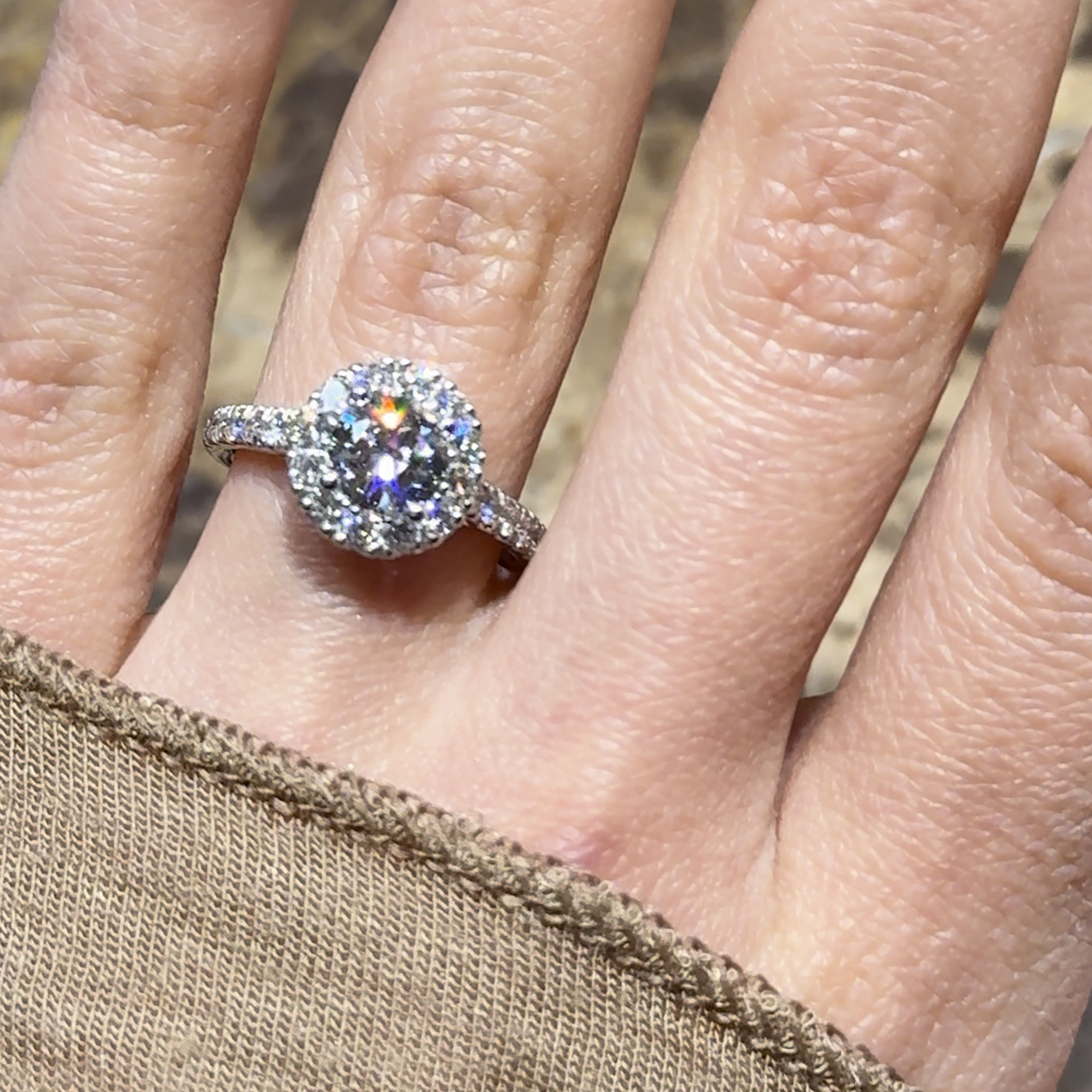18k white gold. chunky round lab-grown diamond halo engagement ring with pavé band