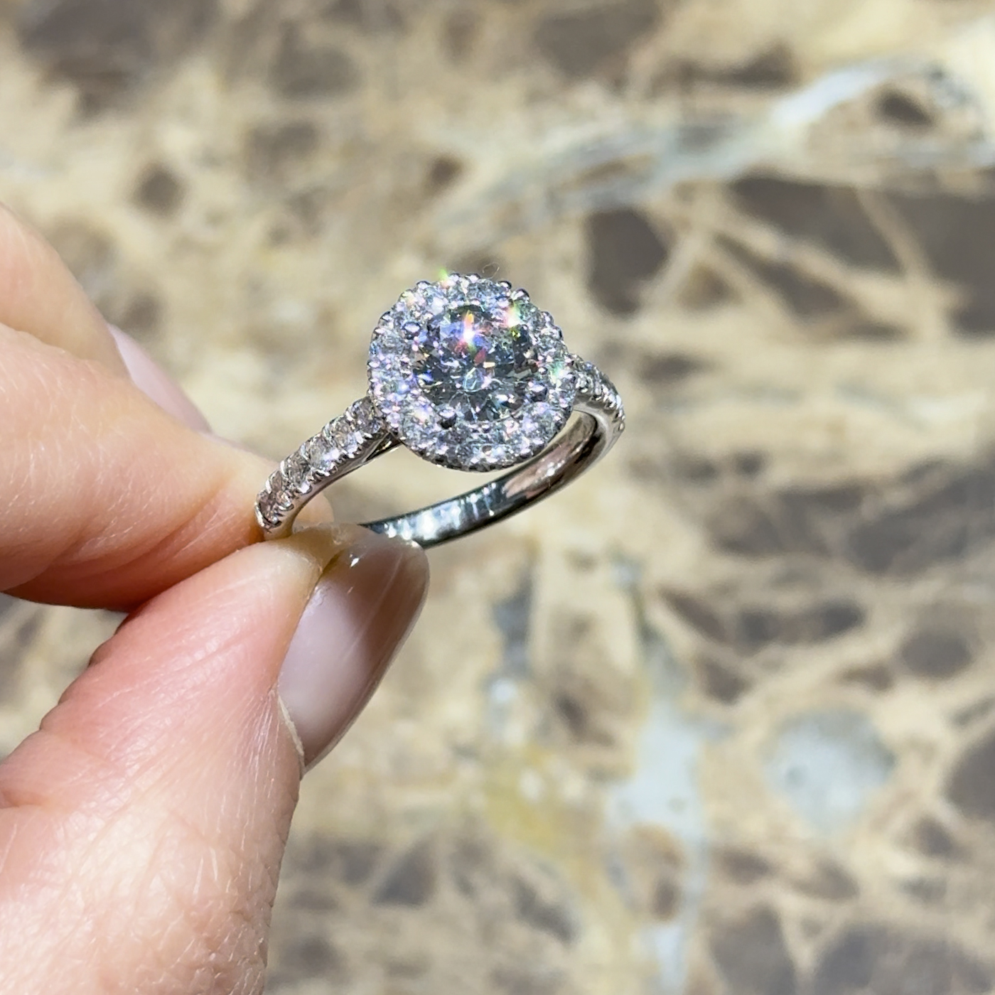 18k white gold. chunky round lab-grown diamond halo engagement ring with pavé band