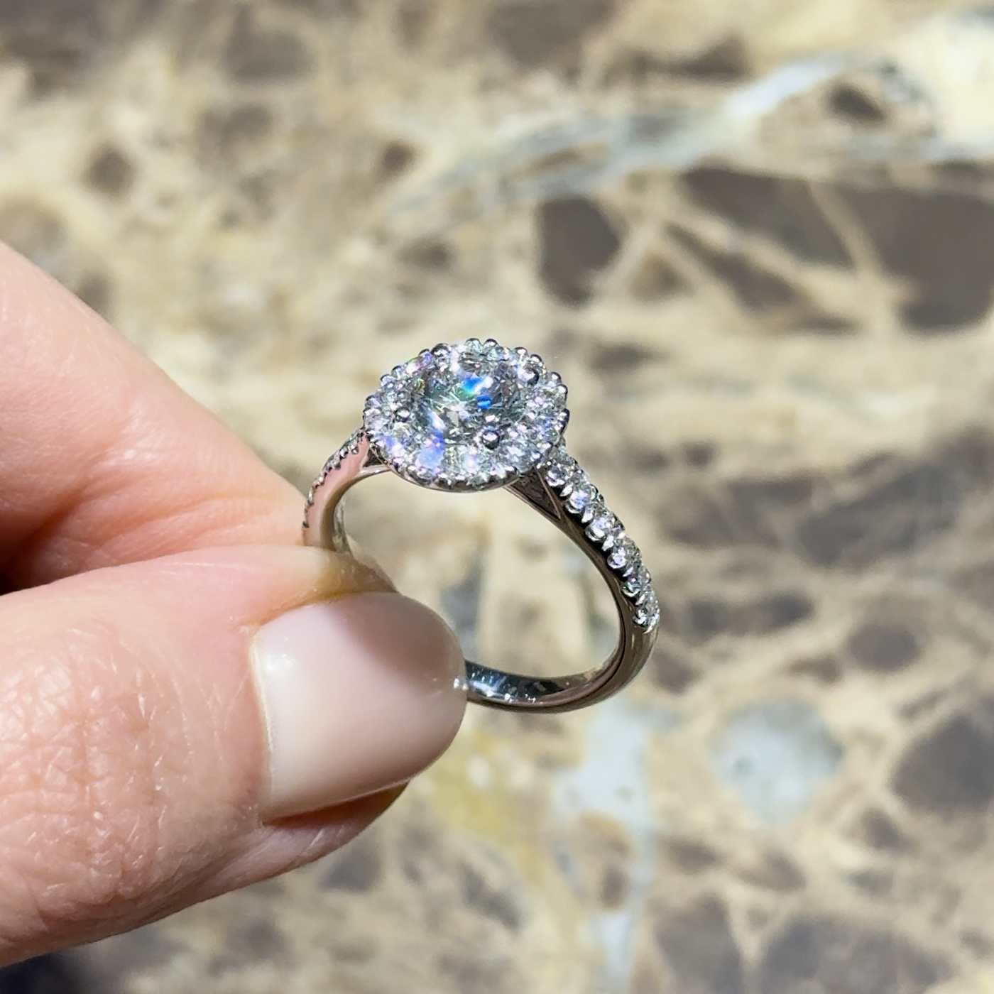 18k white gold. chunky round lab-grown diamond halo engagement ring with pavé band