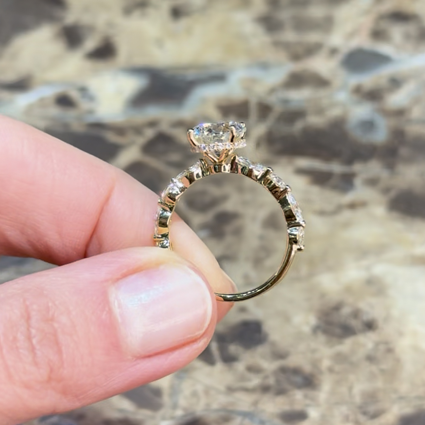 18k yellow gold  18k yellow gold round lab-grown diamond engagement ring with hidden halo and half-set marquise & round side diamonds
