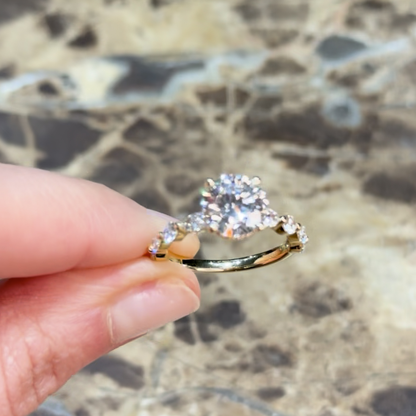 18k yellow gold  18k yellow gold round lab-grown diamond engagement ring with hidden halo and half-set marquise & round side diamonds
