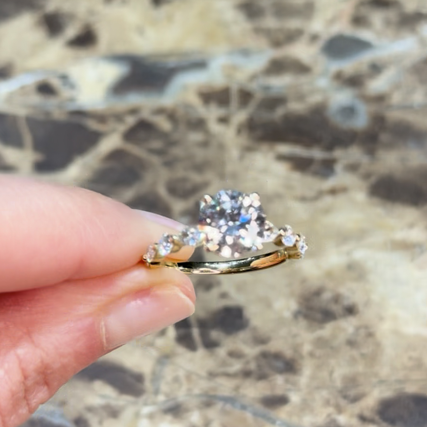 18k yellow gold  18k yellow gold round lab-grown diamond engagement ring with hidden halo and half-set marquise & round side diamonds