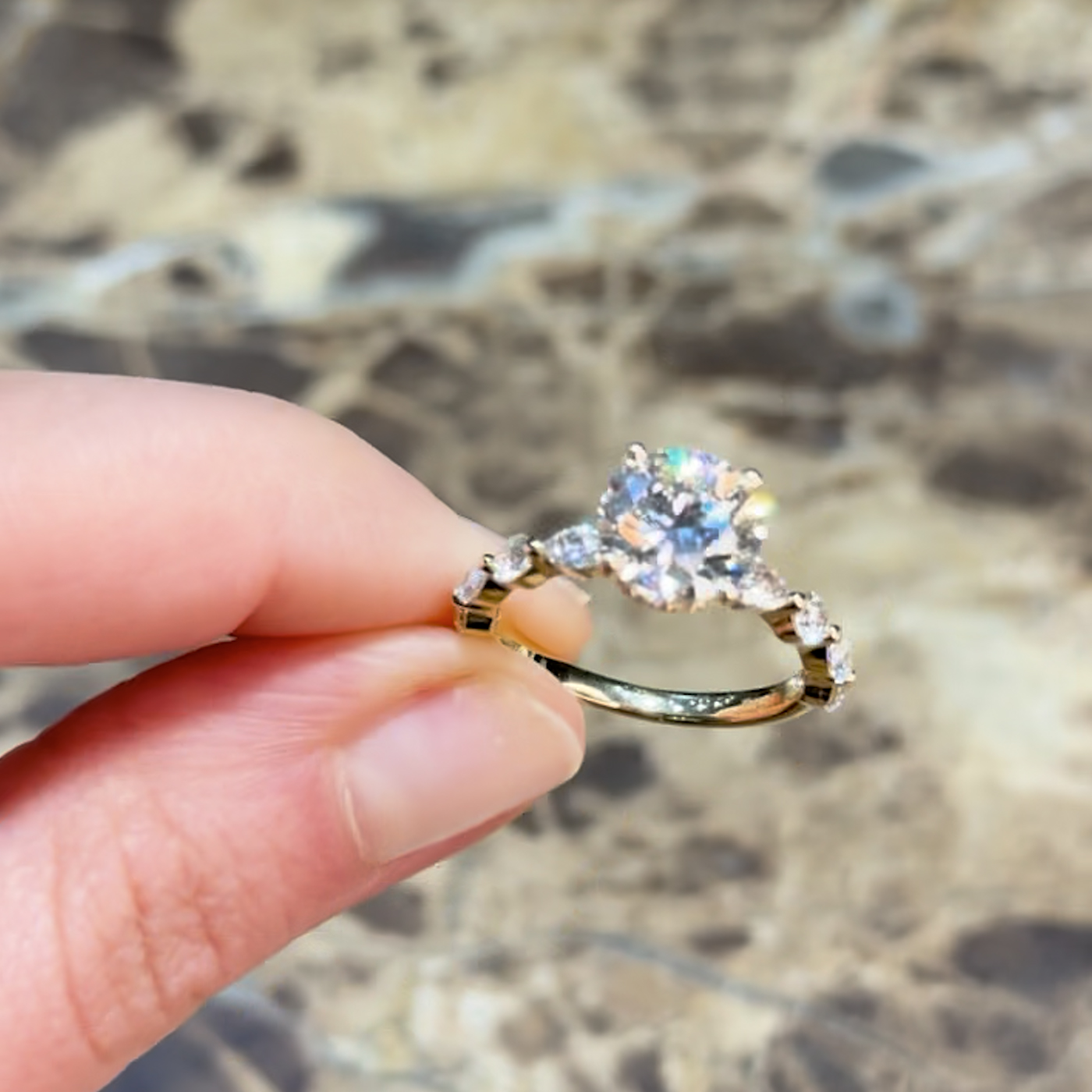 18k yellow gold  18k yellow gold round lab-grown diamond engagement ring with hidden halo and half-set marquise & round side diamonds